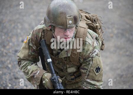 Oklahoma Army National Guardsman, Sgt. James Elkins, III, member of Headquarters Company, 1st Battalion, 179th Infantry Regiment, 45th Infantry Brigade Combat Team (IBCT), conducts squad-level lane training Nov. 22, 2016, during pre-mobilization at Camp Gruber Training Center (CGTC), near Braggs, Oklahoma, in preparation for their deployment to Ukraine. The 179th is the first of two six-month rotations to the Ukraine as part of the Joint Multinational Training Group-Ukraine, a training mission focused on providing defensive and security training to Ukrainian forces within the U.S. Security Coo Stock Photo