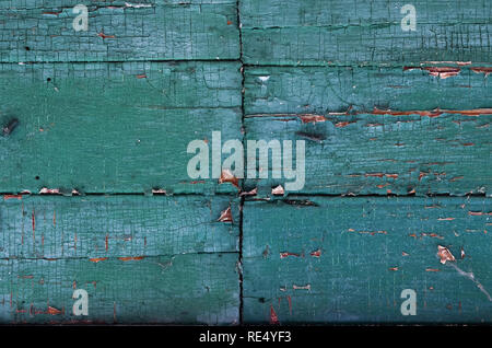 Close-up full frame shot of turquoise old rusty peeling wooden wall as a background Stock Photo