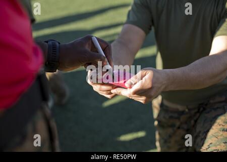 https://l450v.alamy.com/450v/re50pw/us-marine-corps-staff-sgt-maurice-e-jeffries-left-senior-drill-instructor-with-company-b-1st-recruit-training-battalion-recruit-training-regiment-writes-on-a-recruits-score-card-at-marine-corps-recruit-depot-san-diego-calif-nov-30-2016-jeffries-annotated-the-recruits-score-upon-the-completion-each-events-during-a-combat-fitness-test-re50pw.jpg