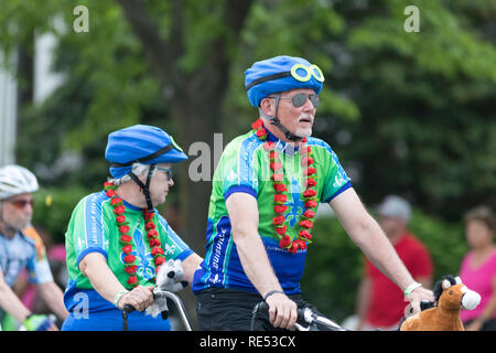 Louisville, Kentucky, USA - May 03, 2018: The Pegasus Parade, Older Couple riding a double bicycle down W Broadway Stock Photo