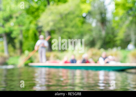 Defocused background impressionist scene of tourists being punted along Avon River in Christchurch New Zealand Stock Photo
