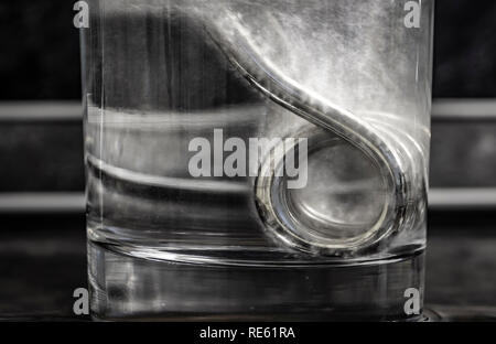 Portable boiler in a glass of water. Stock Photo
