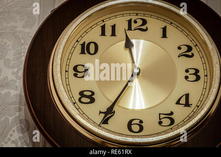 Wall pendulum clock with the fight in the old style. Stock Photo