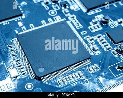 Closeup image of microprocessor on electronic circuit board. Blurred and toned image. Shallow DOF. Stock Photo