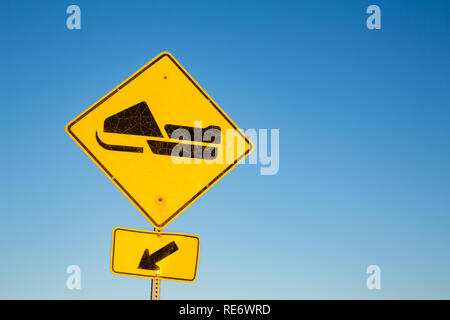 Yellow road sign for Skidoo or Snowmobile trail, with blue sky background and space for text. Quebec Province, Canada. Stock Photo