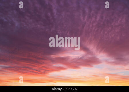 Dramatic sunset clouds with pink and purple sky Stock Photo