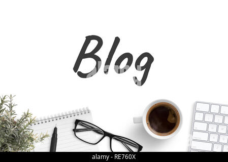 Blog text on white office desk. Notepad, pencil, glasses, cup of coffee, plant and keyboard on bottom. Write blog concept. Top view, flat lay. Stock Photo