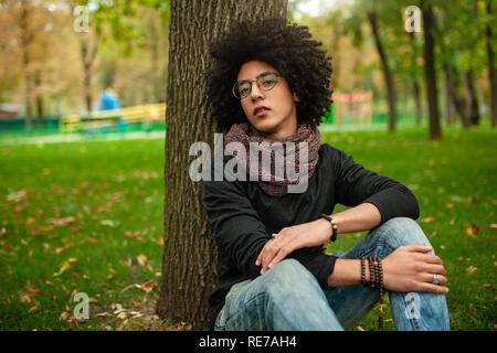 African-American male student sits alone at table during 