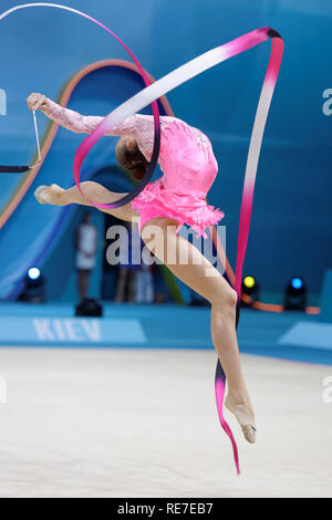 Kiev, Ukraine - August 30, 2013: Unidentified female gymnast performs with ribbon during 32nd Rhythmic Gymnastics World Championships. The event is he Stock Photo