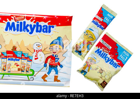 Nestle Milkybar selection pack containing milkybar small bars and  milkybar pieces mini bag chocolate set on white background - ready for Christmas Stock Photo