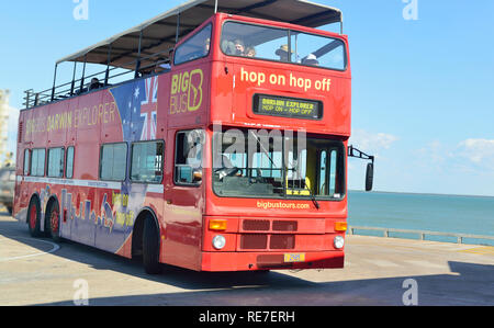 The red double decker Hop On Hop Off bus on tour in Darwin, Northern Territory, Australia