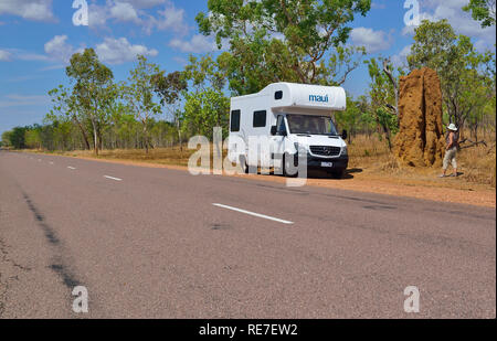 Motorhome tourist stops on the road side to look at a cathedral termite mound one of most iconic sites in Kakadu Northern Territories Australia Stock Photo