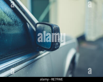 The damaged wing mirror on an old car Stock Photo