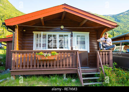 Stryn Norway 26 06 2018 Man In Red Camping Cabins For