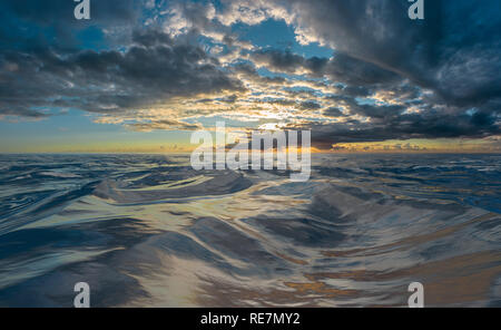 Sunset or sunrise over rough water Stock Photo