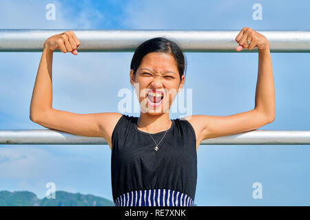 Beautiful woman posing - making a face, showing gesture and funny Stock Photo