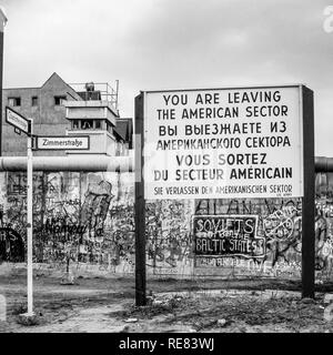 August 1986, leaving American sector warning sign, Berlin Wall graffitis, East Berlin watchtower, Zimmerstrasse street sign, West Berlin, Germany, Stock Photo