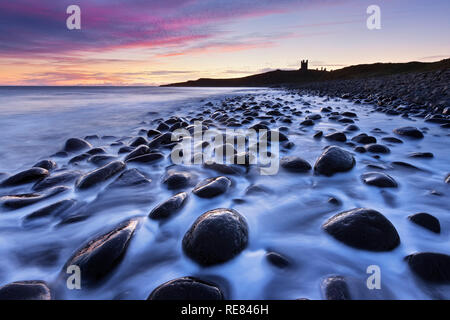 Dunstanburgh Castle and Embleton Bay, Northumberland, England Stock Photo