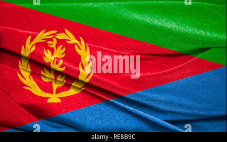 Realistic flag of Eritrea on the wavy surface of fabric. Perfect for background or texture purposes. Stock Photo