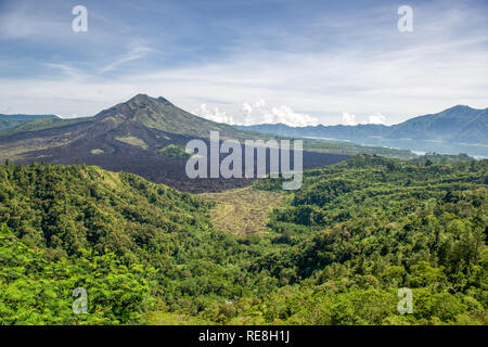Mount Batur viewed from Kintamani in Bali. Mount Batur is 1717 meters high and an active volcano, which last erupted in 2000. Stock Photo