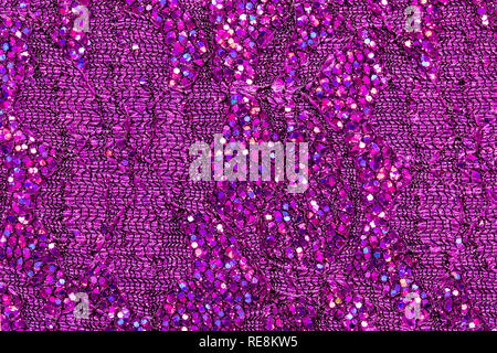 Abstract textured background of pink sequins and lace Stock Photo