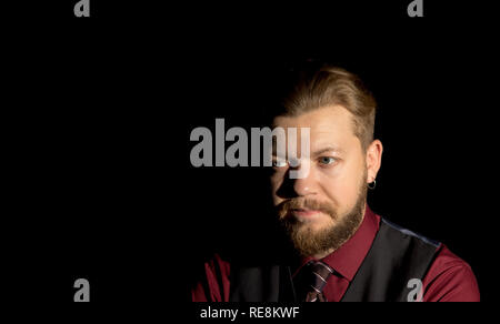 image of a man with a beard on a black background Stock Photo