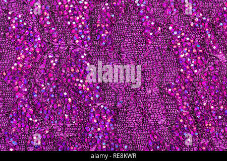 Abstract textured background of pink sequins and lace Stock Photo