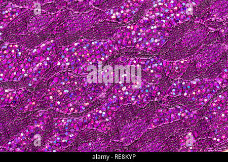 Abstract textured background of pink sequins and lace Stock Photo