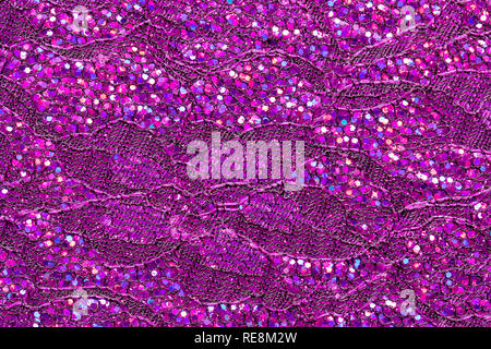 Abstract textured background of pink sequins and lace Stock Photo