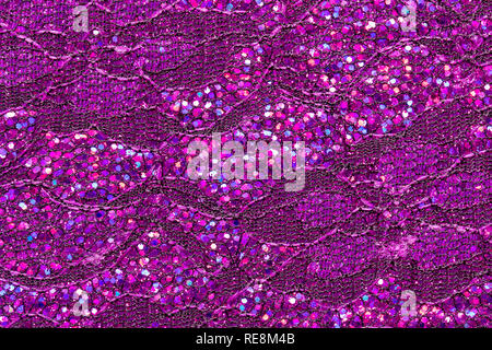 Abstract textured background of pink sequins and lace Stock Photo
