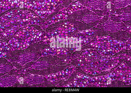 Abstract textured background of pink sequins and lace Stock Photo
