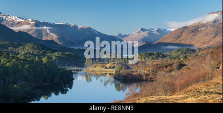 Looking west towards Loch Affric and the surrounding mountains with Affric Lodge ancillery buildings in the centre. Stock Photo