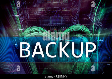 Backup button on modern server room background. Data loss prevention. System recovery Stock Photo