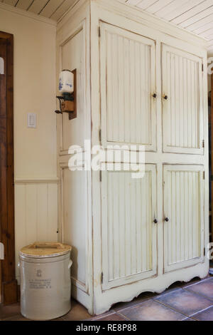 Kitchen With Cream Coloured Antique Finish Wooden Cabinets