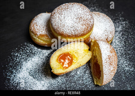 Berliner Doughnuts European donuts tradicional bakery for fasching carneval time with peach jam in Europe Stock Photo