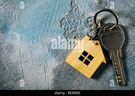 Keys to the apartment on the table with copy space, top view Stock Photo