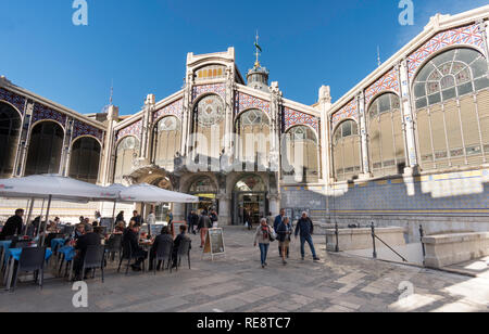 People sitting outside at the Bar Cerveceria Fox restaurant next to the market in Valencia, Spain, Europe Stock Photo