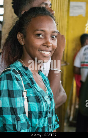 Nosy Be, Madagascar - January 17th, 2019: Portrait of a Malagasy woman looking camera at the central market in Nosy Be, Madagascar. Stock Photo