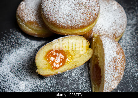 Berliner Doughnuts European donuts tradicional bakery for fasching carneval time with peach jam in Europe Stock Photo