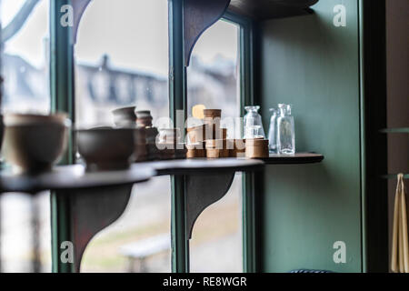 Containers, jars, and vials on the window shelf of an apothecary shop Stock Photo