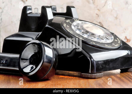 Old style black rotary telephone. Stock Photo