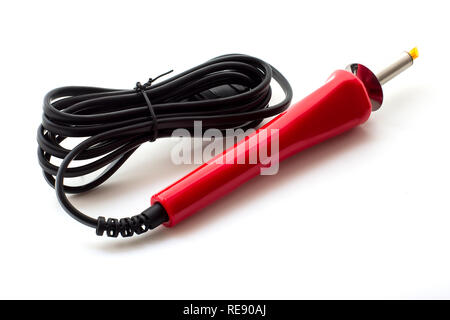 Soldering tool isolated on a white background. New soldering iron with red handle close-up Stock Photo