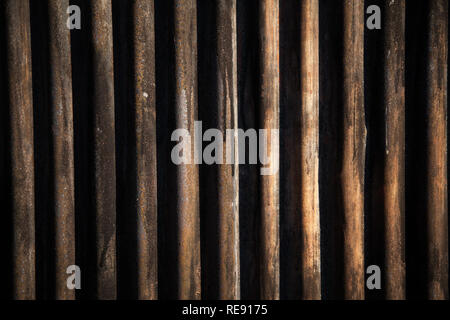 Corrugated iron, painted black, full frame backdrop with subtle winter sunlight. Stock Photo