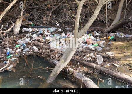 North Carolina creek filled with plastic bottles and trash Stock Photo