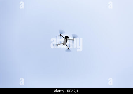 View of a drone flying on white background... Stock Photo