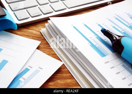 Pile of business documents on desk. Financial papers in the office. Stock Photo