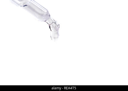 waterdrop with little waves from a pipette Stock Photo