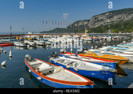 LAKE GARDA, ITALY - SEPTEMBER 2018: Small fishing boats moored in the harbour at the town of Garda on Lake Garda. Stock Photo