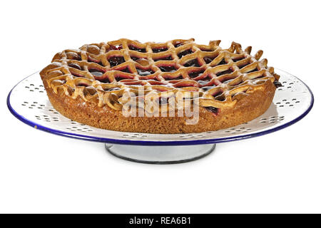 cherry cake on an enamel plate isolated on white background Stock Photo
