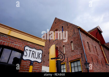 Groningen, The Netherlands: Restored medieval buildings in Europe, painted with bright red and yellow trim. Nothern Shipping Museum. Middle ages archi Stock Photo